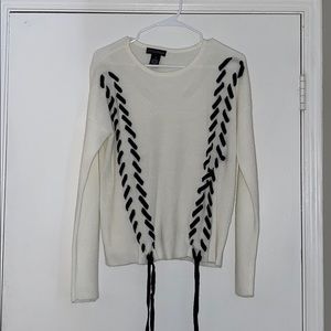 Fun white sweater with black ties!